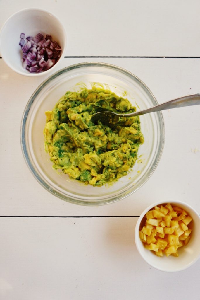traditional guacamole and add-ins; red onion and pineapple