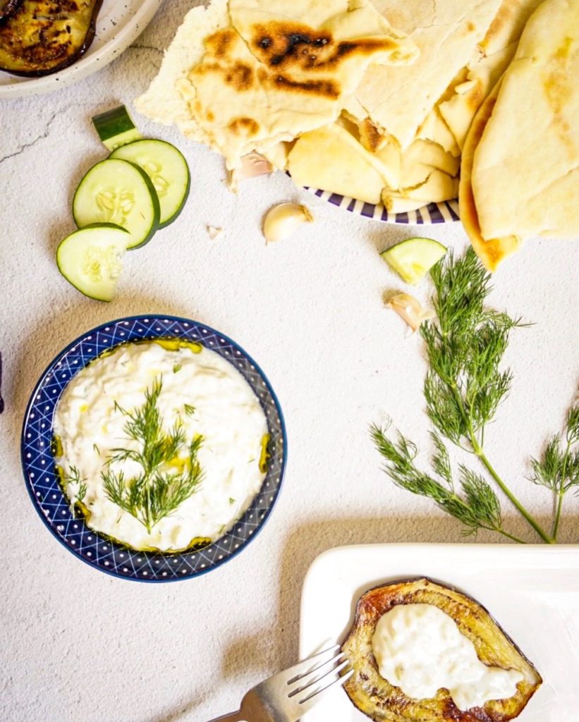 tzatziki in a bowl with pita bread