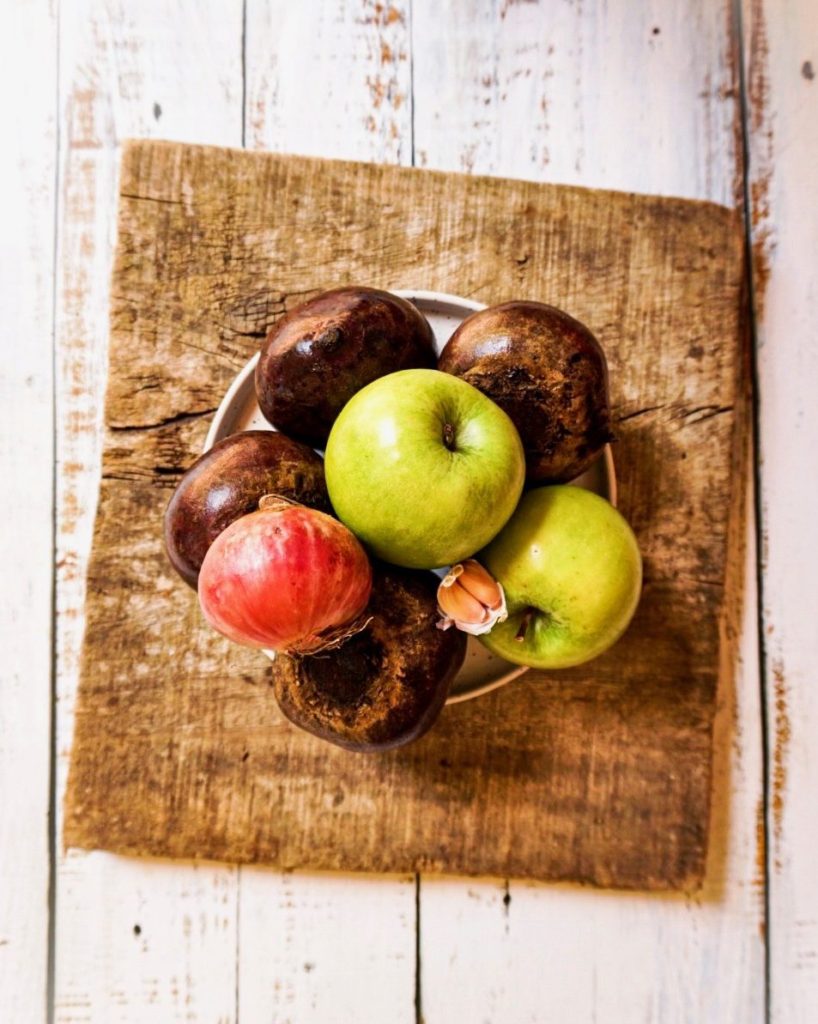 Beetroot soup's wholesome ingredients; apples, beetroots, red onion and garlic