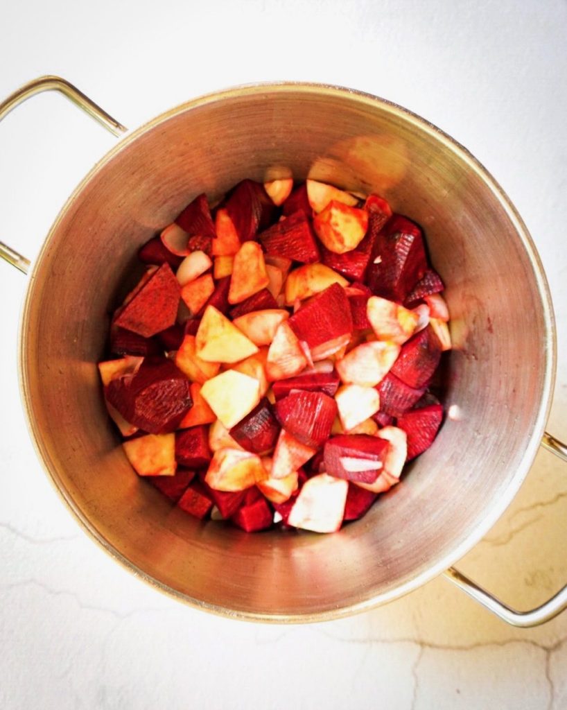 Beetroot soup ingredients in soup pot; totally plant based and gluten free