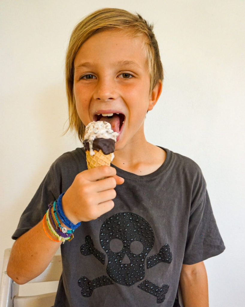 kid licking nice cream in cone