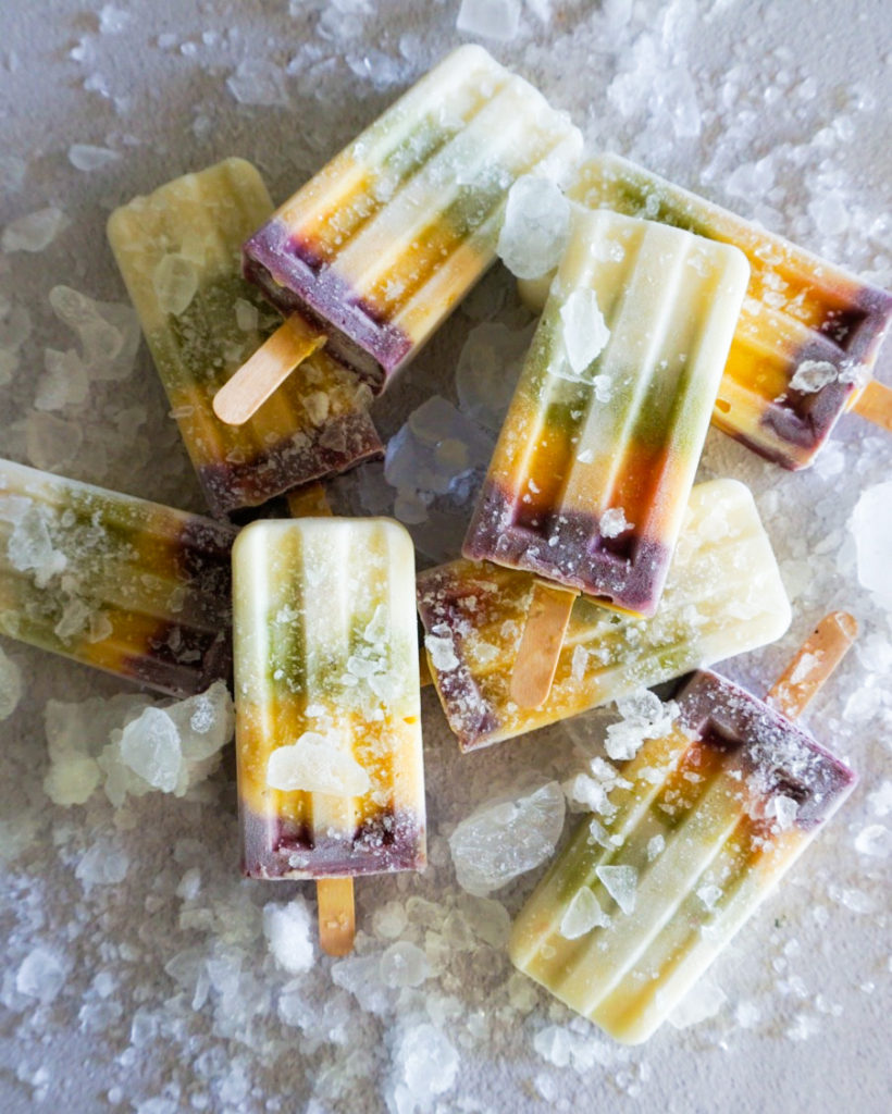a pile of rainbow popsicles