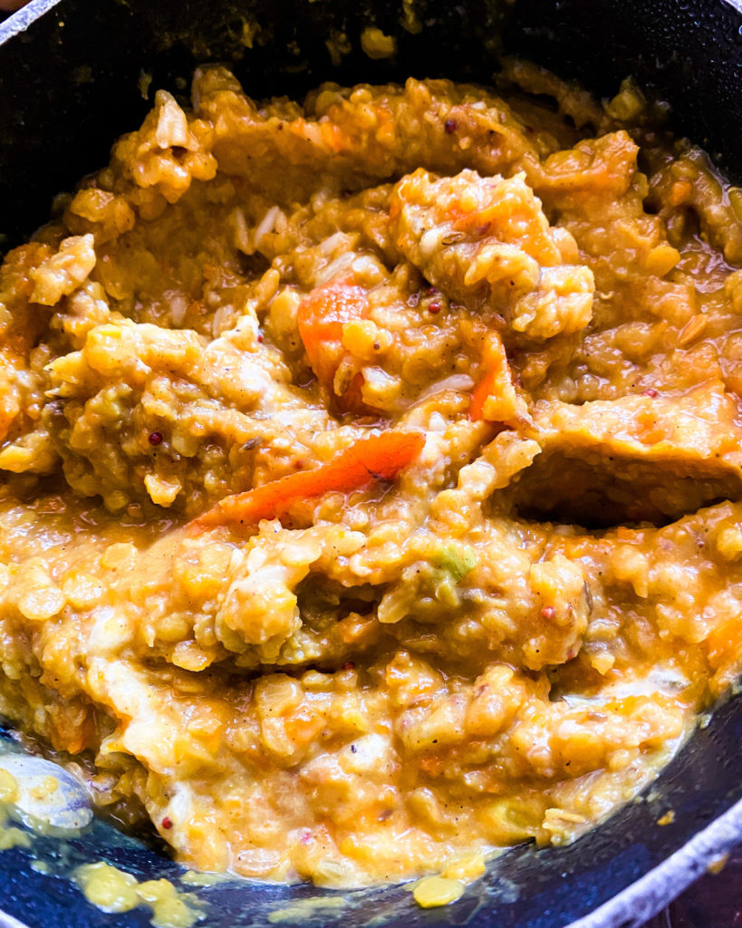 close up of dal cooking in a pan