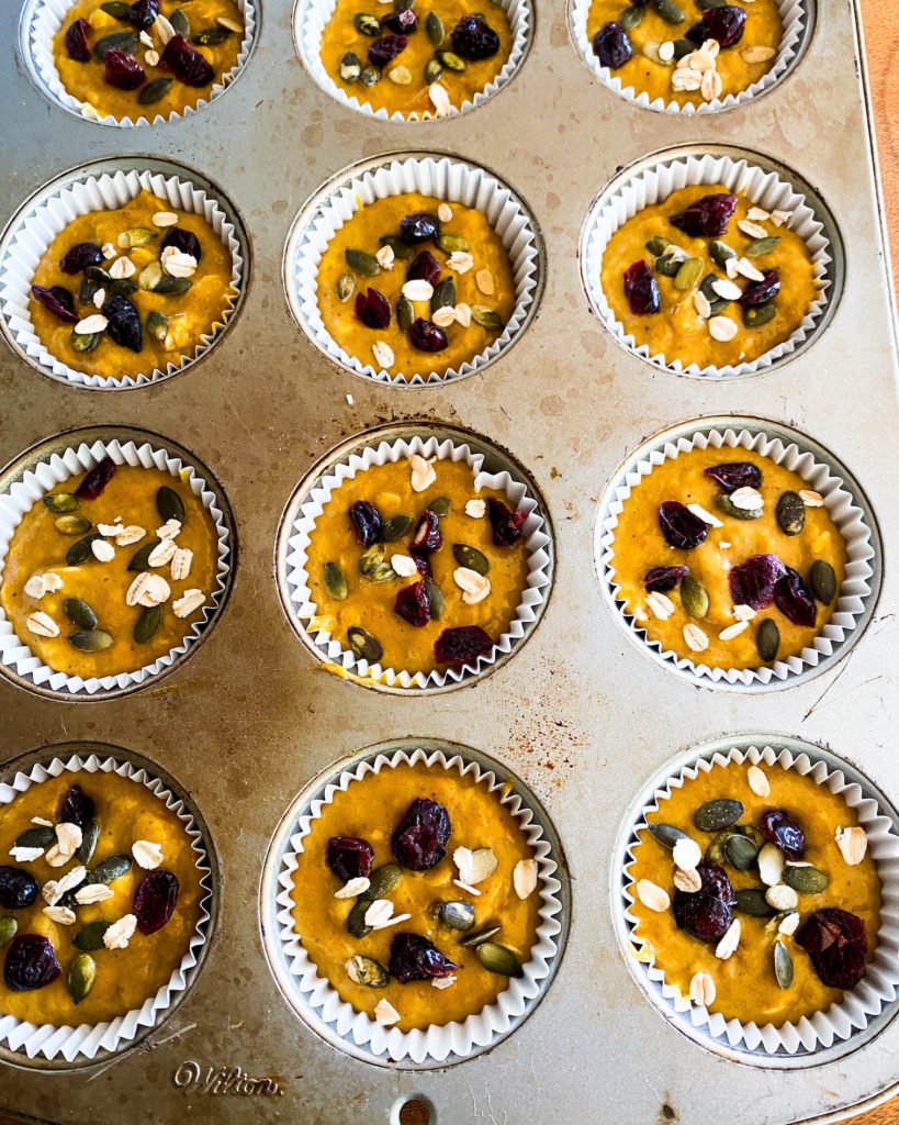 Tin filled with batter and toppings