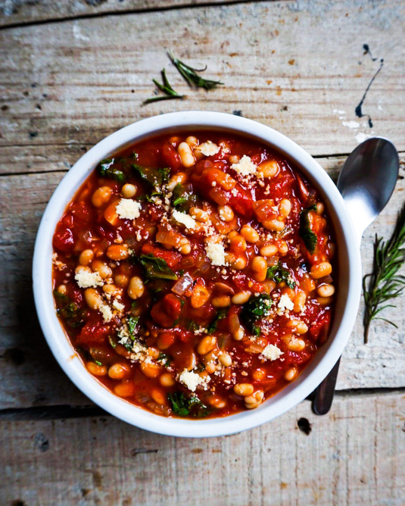 a bowl of rosemary white bean tomato stew