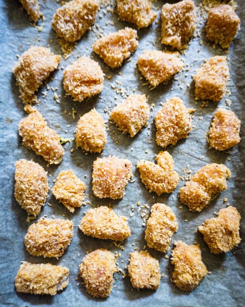 breaded chicken on a baking sheet