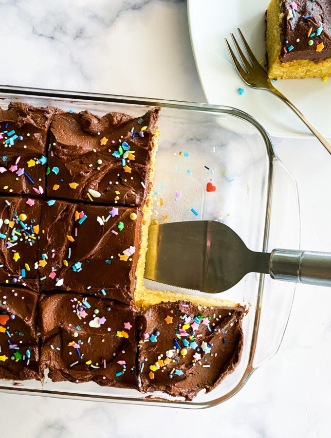 scooping a piece of sheet cake up