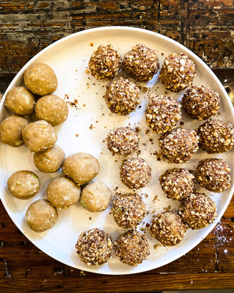 plate filled with apple pie bites half rolled in pecan crumble