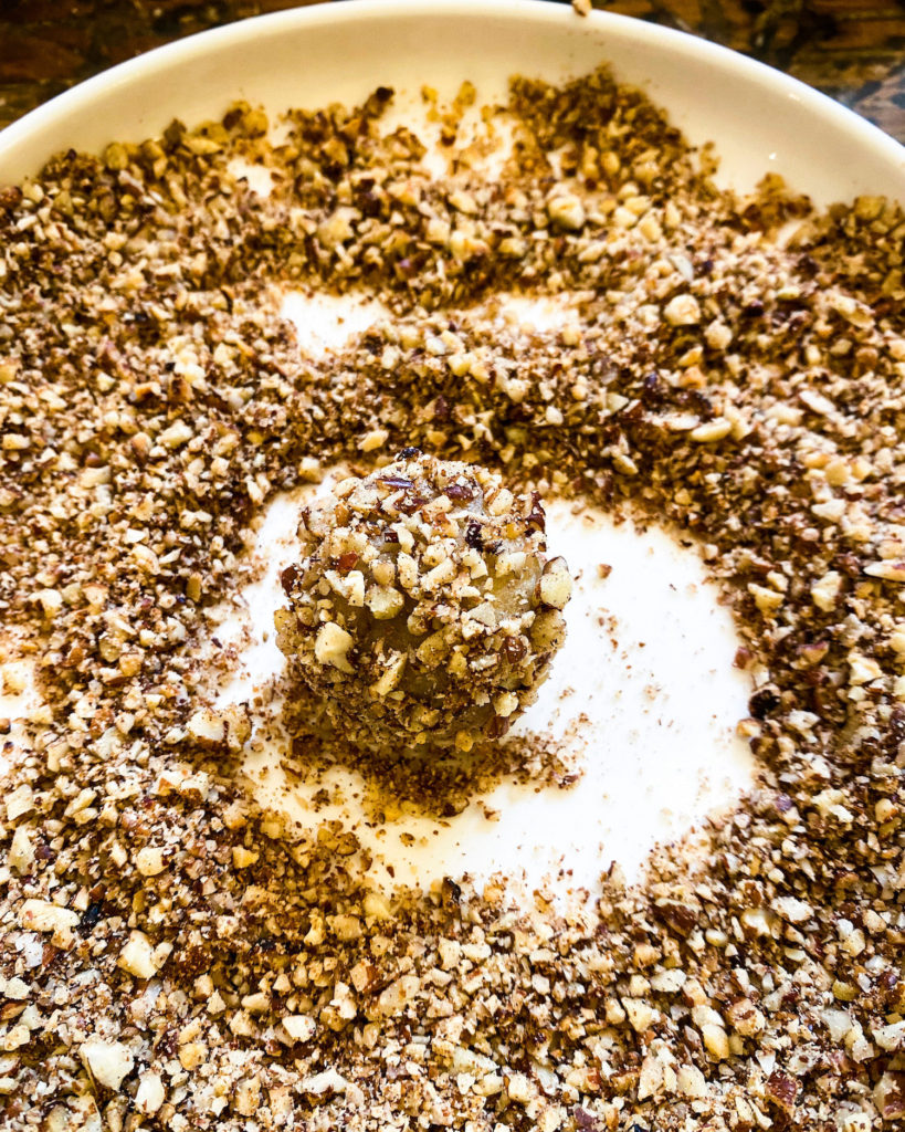 rolling balls through pecan crumble