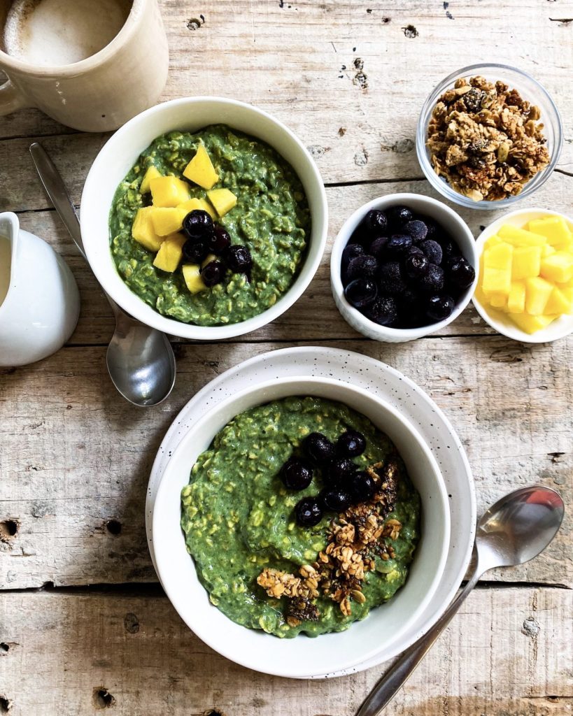 green goddess overnight oats divide over bowls with toppings on the side