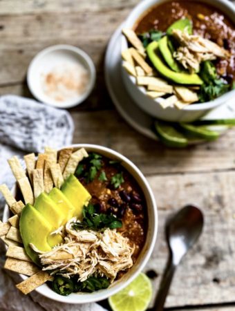 two bowls of tortilla soup with garnishing