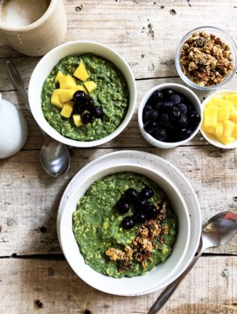 green goddess overnight oats divided over bowls with toppings on the side