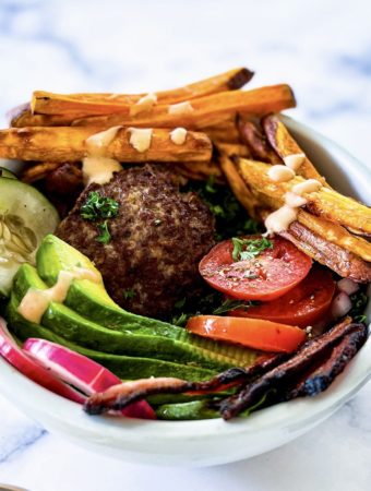 burger, fries and garnishing on top of lettuce