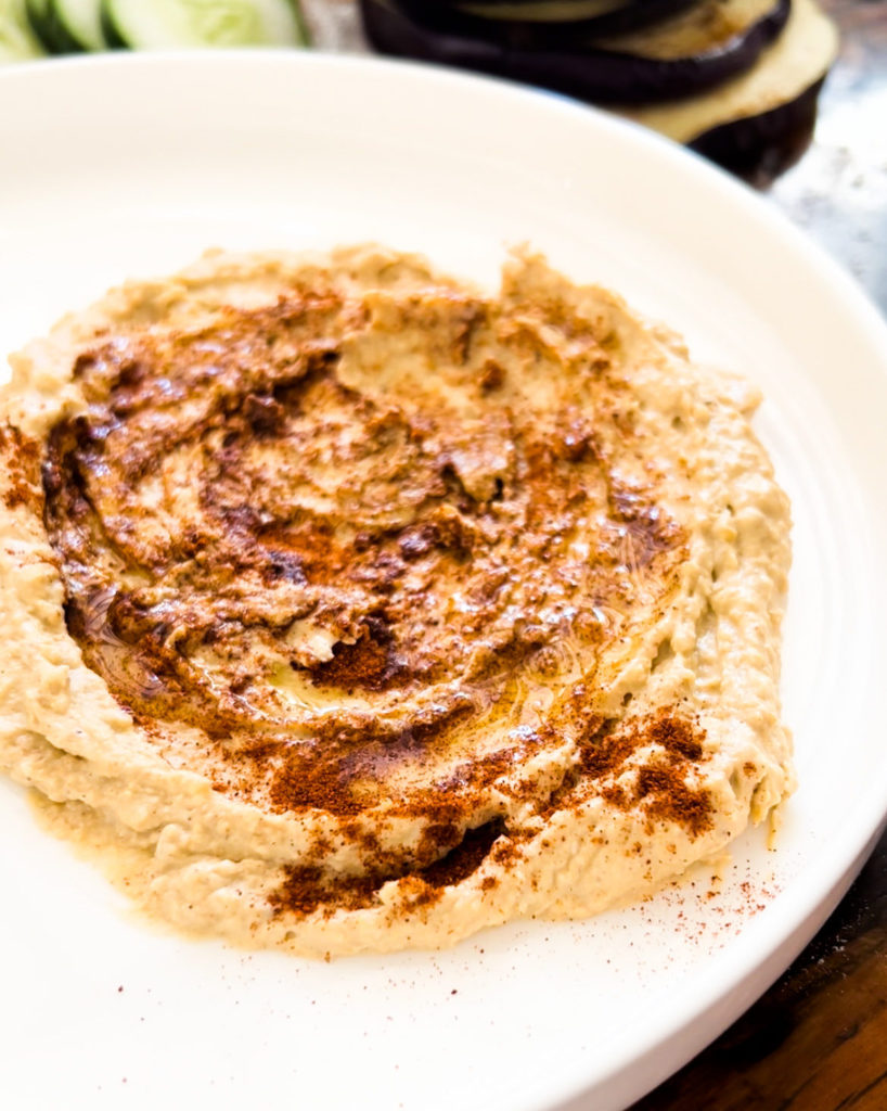 hummus spread out on a plate