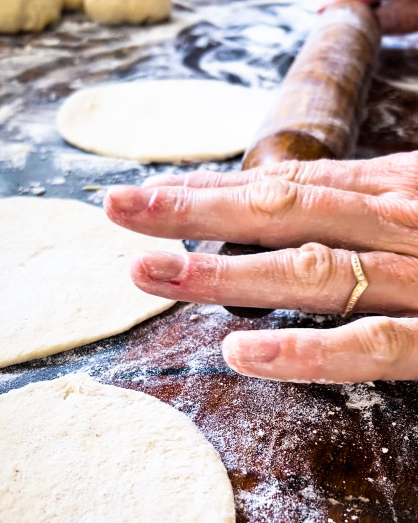 rolling out naan bread