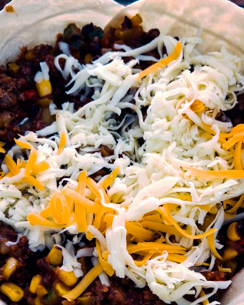 adding cheese to the filling