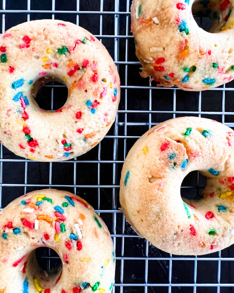 donuts cooling off on a rack