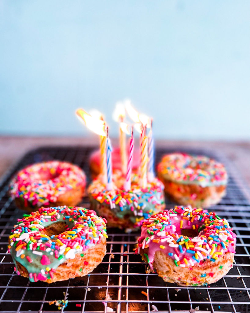 sprinkled donuts with candles