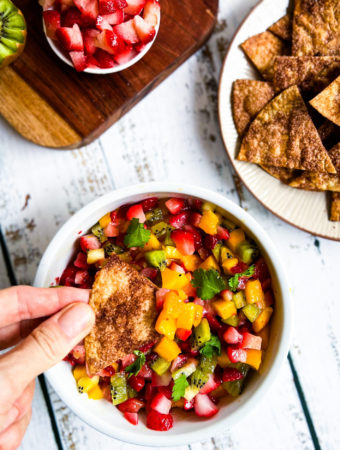 scooping up fruit salsa with cinnamon sugar chips
