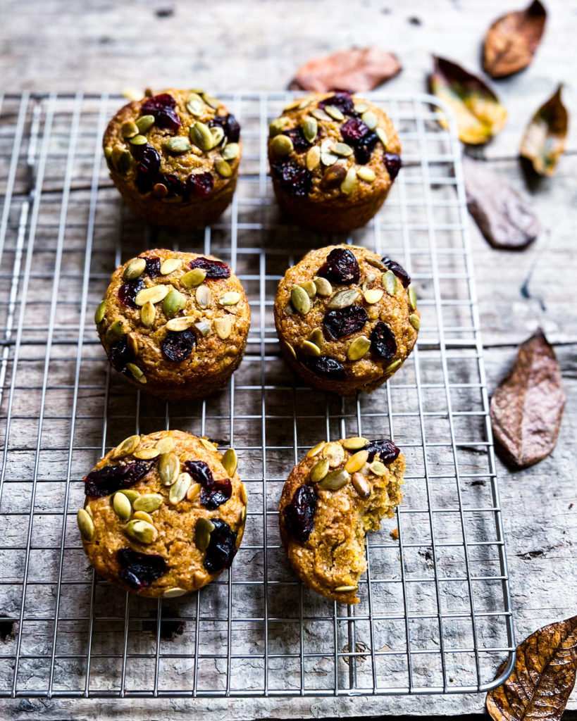 fall inspired pumpkin muffins on a cooling rack