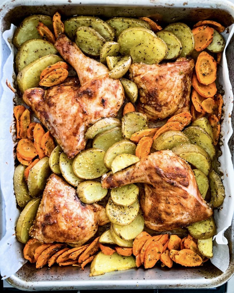 lemon baked chicken and potatoes bake tray just out of the oven