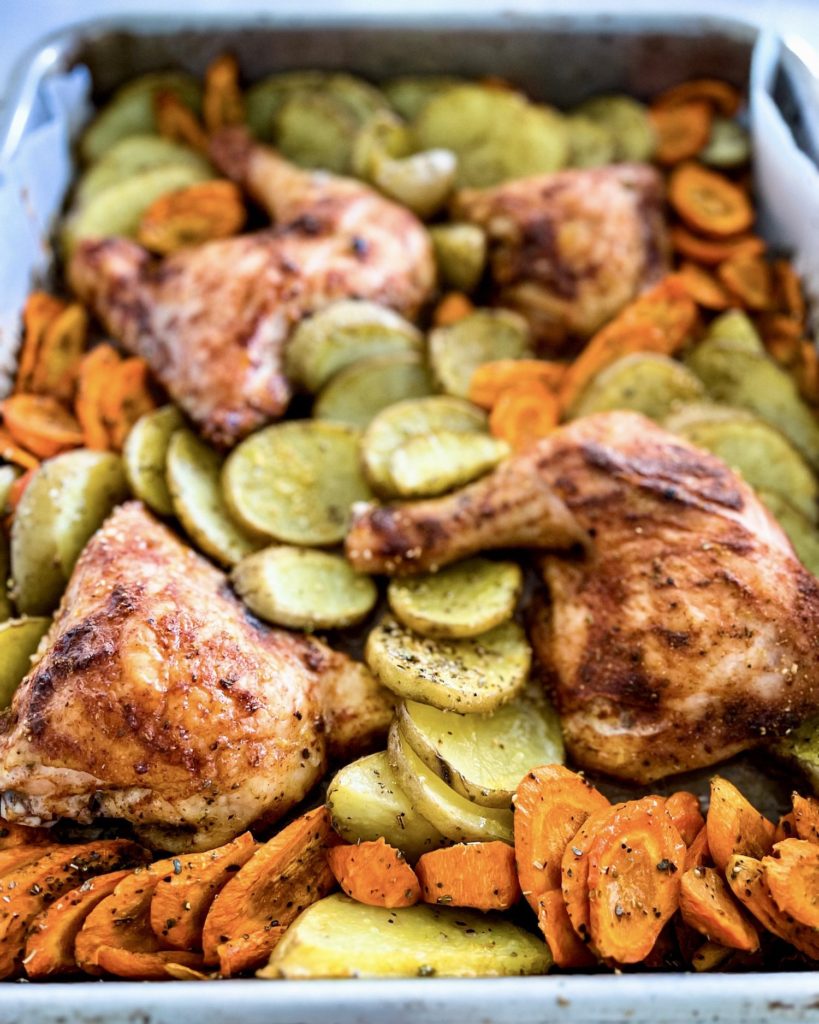 lemon baked chicken and potatoes bake tray just out of the oven