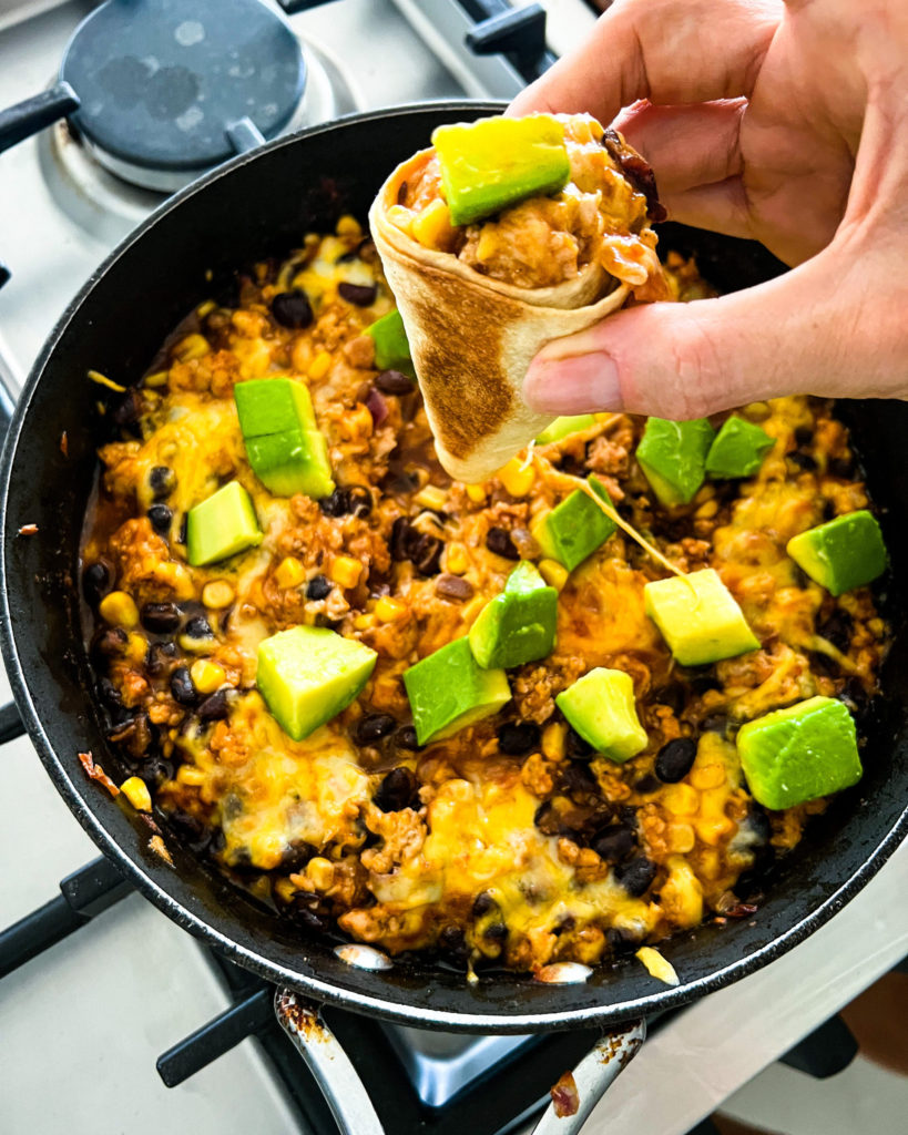 Quick And Easy Chicken Enchilada Dip A Recipe By Familicious   Chicken Enchilada Dip In A Tortilla Cone Scaled E1682371599742 819x1024 