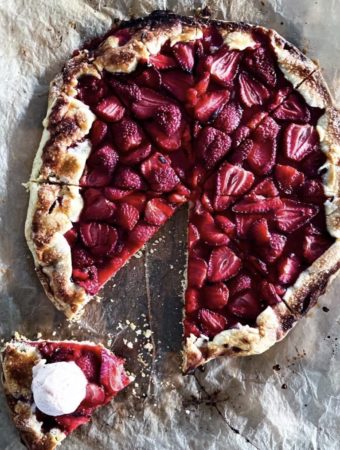 Slice of galette with a scoop of ice cream on it