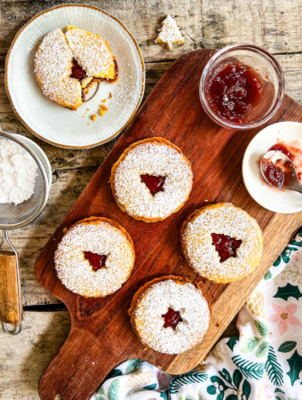 linzer cookies filled with raspberry jam and dusted with powdered sugar