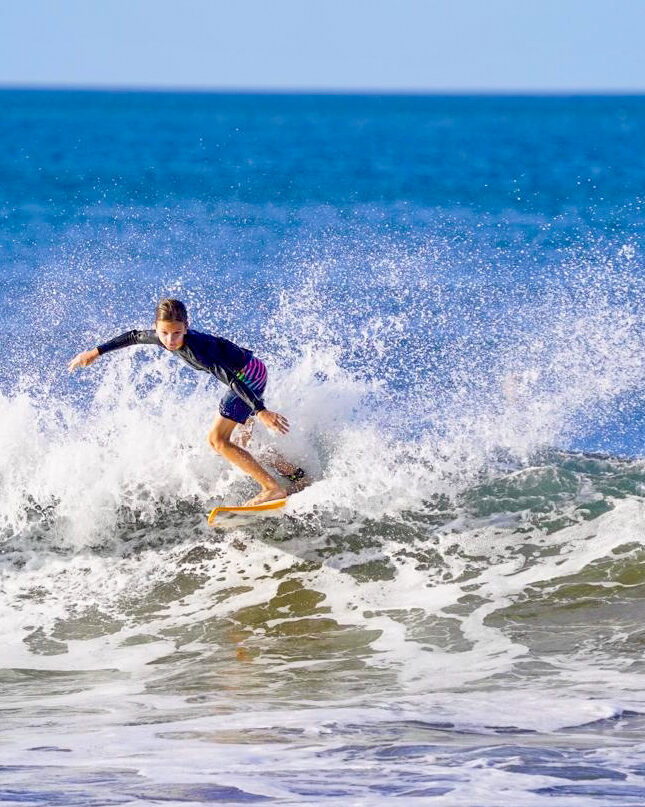 Close up of Jack surfing