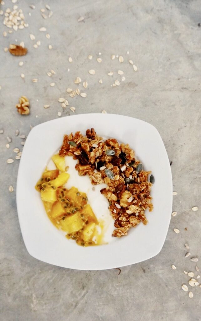 Yogurt, granola and fresh fruit in a bowl